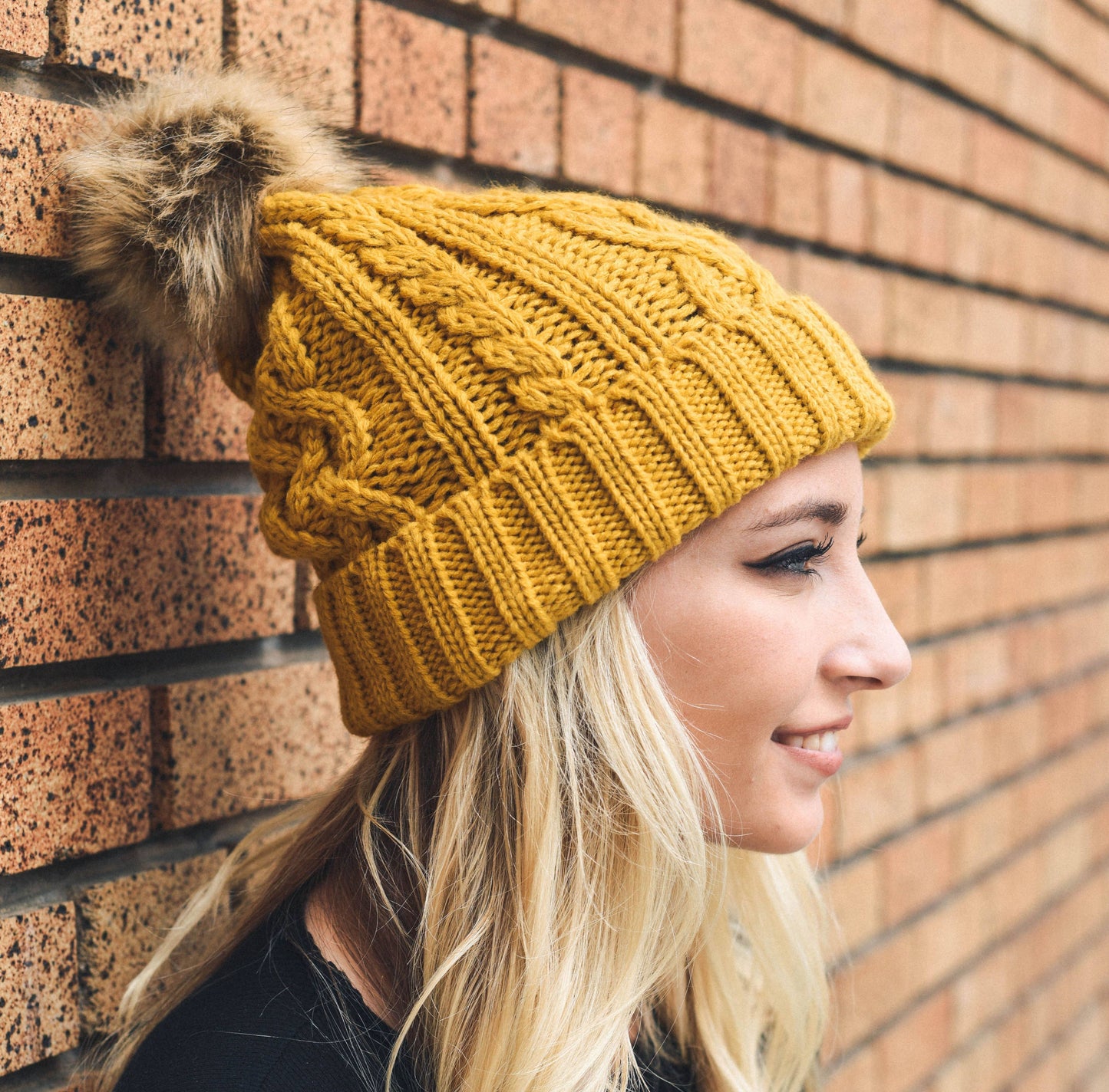 Cable Knit Beanie With Faux Fur Pom in Mustard